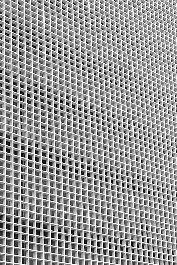 modern building, minimalist facade, symmetrical grid pattern, urban architecture, detailed design, contemporary structure, architectural detail, geometric pattern, urban building, modern facade, minimalist architecture