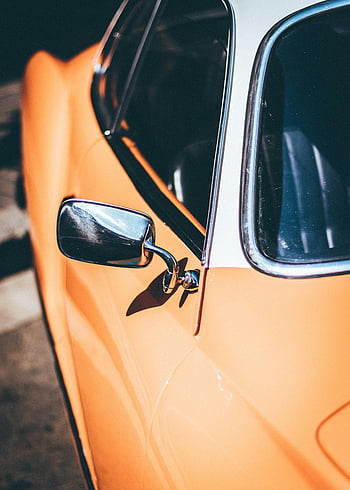 Vintage oranžové auto, klasické auto, Chromové detaily, Barcelona, ​​Španělsko, detailní fotografie, ročník vozidla, Oranžový automobil, detaily veteránů, Části chromového vozu, oranžový exteriér auta