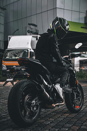man in black, black motorcycle, urban setting, biker, black gear, motorcycle rider, city street, helmet, motorbike, urban biker, black clothing