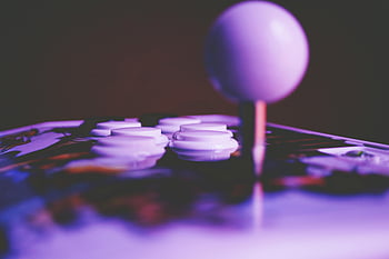 arcade joystick, retro gaming, close-up photography, vibrant image, arcade buttons, gaming mood, arcade control panel, joystick buttons, arcade machine, gaming equipment, arcade closeup