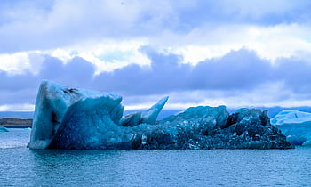 iceberg, blue iceberg, cold sea, serene sea, cloudy sky, icy beauty, nature photography, large iceberg, ice photography, arctic landscape, frozen ocean