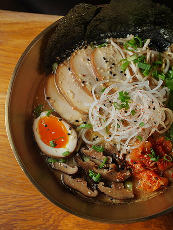 ramen bowl, top view, egg, mushrooms, seaweed, cozy setting, flavorful ramen, ramen ingredients, ramen toppings, ramen dish, ramen meal