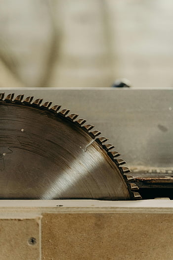 table saw, circular saw blade, close-up shot, industrial themes, sharp blade, woodworking tools, detailed image, sawing equipment, workshop tools, precision cutting, metal blade
