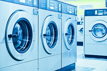 gray front load washing machines, industrial washing machines, contemporary laundromat, row of washing machines, front load washers, laundromat equipment, laundry machines, commercial laundry, washing machine row, modern laundromat, laundry appliances
