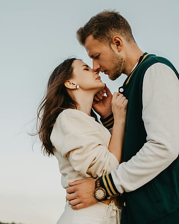 loving couple, kissing, street, tender moment, outdoor setting, romance, affection, young couple, romantic scene, affectionate couple, outdoor romance