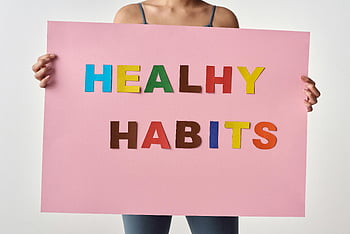 woman, pink poster, HEALTHY HABITS, colorful letters, holding sign, healthy lifestyle, habits, message, poster, health