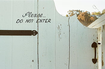white wooden gate, Do Not Enter sign, sunlit day, outdoor scene, wooden fence, private property, daytime photo, rustic gate, outdoor warning sign, natural light, daytime outdoor