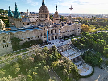 Montjuic National Palace, Barcelona Spain, aerial photo, National Palace Montjuïc, lush greenery, Barcelona architecture, Montjuic hill, historic building, cityscape view, cultural landmark, European landmarks