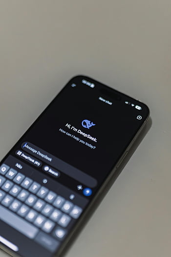 smartphone, AI chatbot, DeepSeek AI, conversation interface, close-up, screen display, mobile device, chat interface, artificial intelligence, technology, communication