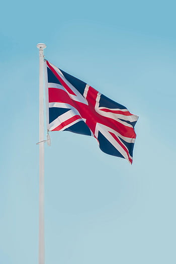 Union Jack, United Kingdom flag, flagpole, clear blue sky, London, waving flag, British flag, UK flag, national symbol, outdoor scene, Union Flag