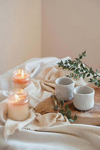 candles, jars, tranquil spa, ceramic cups, greenery, soft fabric, lit candles, spa arrangement, ceramic mugs, wooden tray, natural decor