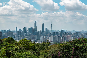 Guangzhou cityscape, skyscrapers, vibrant greenery, cloudy sky, urban landscape, city view, modern buildings, green trees, urban nature, city skyline, Guangzhou skyline