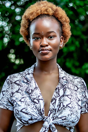 trendy young woman, ethnic lady, natural afro hair, green trees, sunny day, confident portrait, outdoor photo, stylish outfit, afro hairstyle, ethnic fashion, nature background