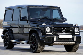 メルセデスGクラス、 ブラックメルセデスGクラス、 豪華なSUV、 屋外駐車場、 洗練されたデザイン、 動力車、 メルセデスベンツ、 高級車、 gワゴン、 ブラックスー、 屋外ショーケース