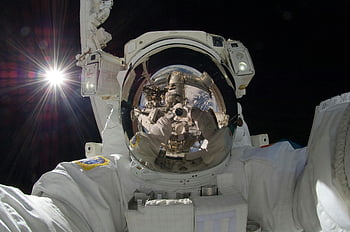 astronaut, space suit, spacewalk, International Space Station, ISS, outer space, space exploration, NASA, space helmet, zero gravity, starburst effect