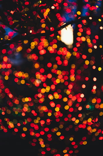 red bokeh lights, yellow bokeh lights, colorful bokeh, festive atmosphere, vibrant hues, red yellow blue, bokeh effect, holiday lights, night scene, abstract lights, festive bokeh