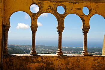 Sintra Palace, vintage arches, ocean view, Portugal, daytime, mountains, sea, concrete baluster, historic architecture, scenic landscape, European landmarks