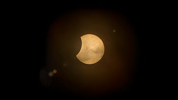 partial solar eclipse, deep dark sky, astronomy enthusiasts, celestial event, solar eclipse photography, night sky, eclipse image, astronomy photo, solar eclipse picture, eclipse capture, dark sky photography