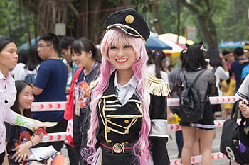 cosplay, Asian woman, costume, outdoor festival, Vietnam, pink hair, military uniform, cosplay event, festival attendees, cosplay character, cosplay outfit