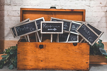 black signages, wooden chest box, chalkboard signs, wooden box, brick wall background, event decor, photo op, restroom sign, vintage signs, rustic decor, event signage