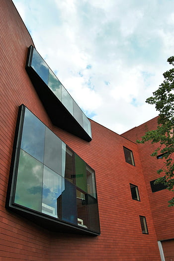 contemporary building, Brugge, large glass windows, sky reflection, modern architecture, exterior design, urban landscape, red brick building, architectural photography, cityscape, building facade