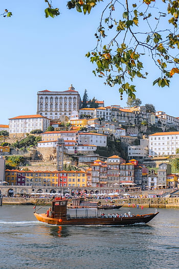 Porto, Portugal, riverside architecture, historic charm, vibrant buildings, city buildings, body of water, Douro River, waterfront, European city, scenic view