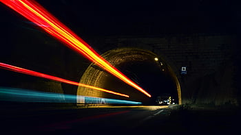 time lapse, tunnel, car lights, long exposure, night photography, dynamic streaks, night scene, tunnel entrance, light trails, dark tunnel, night traffic