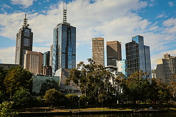 Melbourne skyline, modern buildings, lush greenery, daytime view, high-rise buildings, park near building, urban landscape, cityscape, modern architecture, green park, city park
