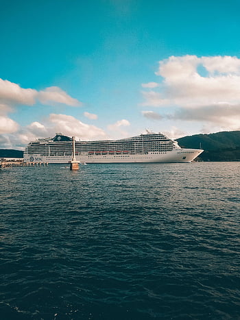cruise ship, sea, bright blue sky, fluffy clouds, calm ocean, grand cruise ship, sailing, MSC, ocean view, maritime, travel