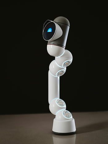 white robot toy, camera lens, modern technology, robotics design, humanoid robot, flat surface, futuristic design, robotic toy, technology showcase, innovative design, robot toy