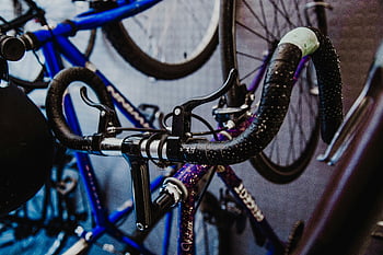 black road bike, bicycle handlebars, bike brakes, urban cycle shop, detailed view, cycling equipment, bike shop, road bicycle, handlebar details, brake system, cycling accessories