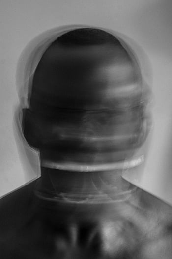 screaming shirtless man, artistic blurred motion, black and white portrait, emotion capture, artistic photography, blurred motion effect, black and white art, emotional expression, artistic portrait, motion blur, shirtless man