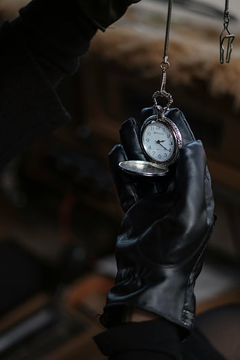 leather gloves, vintage pocket watch, antique pocket watch, leather-gloved hand, nostalgia, elegance, antique timepiece, classic watch, vintage watch, antique jewelry, vintage accessories