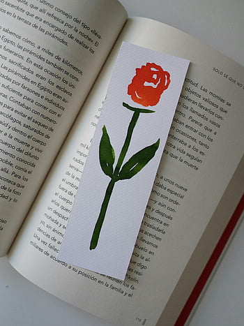 handmade rose bookmark, open book, artistic touch, classic design, book page, reading accessory, decorative bookmark, floral bookmark, book lover gift, reading decoration, book marking tool