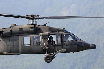 Gray Helicopter, Apache, military helicopter, aerial operations, crew visible, flying helicopter, military aircraft, helicopter in flight, military operations, aerial view, military crew