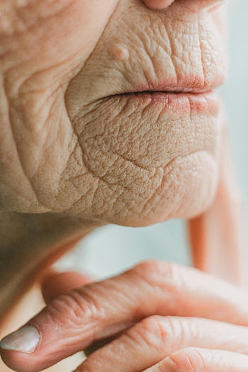 extreme close up, wrinkled skin, senior adult, facial wrinkles, age, skin texture, close-up, detailed, elderly, aging, face