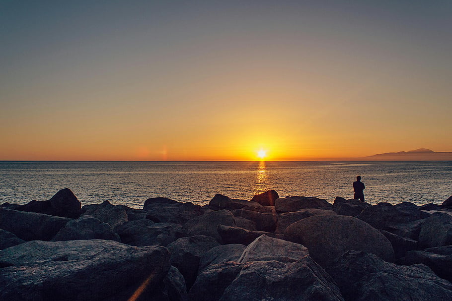 sunset, sea, ocean, rocks, silhouette, golden sky, peaceful view, scenic view, ocean rocks, lone figure, sunset view