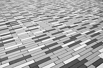 gray concrete pavements, black and white pattern, brick floor, geometric visual effect, abstract design, pavement texture, urban flooring, monochrome pattern, architectural detail, outdoor flooring, geometric flooring