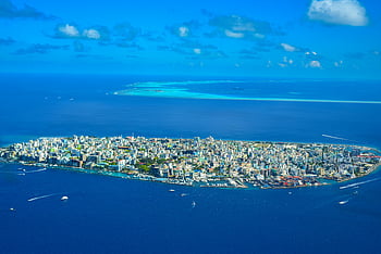 aerial photography, Malé Island, cityscape, vibrant blue ocean, aerial photo, dense city, Maldives, island city, ocean view, urban landscape, tropical city