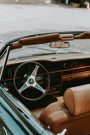 vintage car interior, leather seats, classic car dashboard, retro steering wheel, luxury interior, vintage car, classic car, leather car seats, car interior, retro car, vintage dashboard