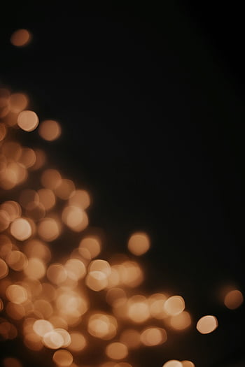 yellow lights, dark background, abstract light bokeh, warm tones, bokeh effect, night lights, soft focus, glowing circles, warm bokeh, dark backdrop, light spots