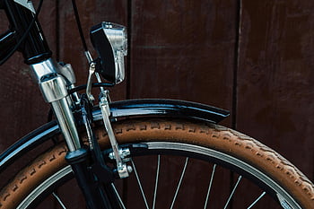 black and grey bicycle, close-up photography, bicycle wheel, fender, tire, handlebar, brake, bike details, urban cycling, bicycle components, bicycle accessories