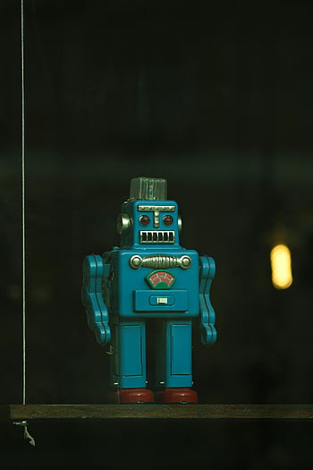 vintage blue toy robot, wooden swing, close-up, dark shelf, retro robot, toy figurine, blue robot, vintage toy, robot collectible, dark background, shelf display