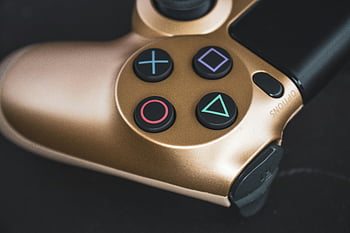 goldener Gamecontroller, Nahaufnahme Foto, Detaillierte Aufnahme, ikonische Knöpfe, Tech-Stockbilder, Gaming-Stockbilder, goldener Gaming-Controller, Nahaufnahmefoto, detaillierter Controller, Tech-Bilder, Gaming-Bilder