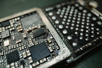 electronic chip, close-up shot, macro shot, electronic circuit board, intricate components, detailed view, circuitry, microelectronics, semiconductor, technology, hardware