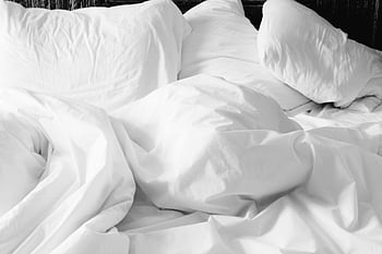 white bed comforter, cozy bed, rumpled sheets, soft pillows, modern bedroom, white bedding, comfortable bed, white duvet, white pillows, bedroom decor, white bed linens