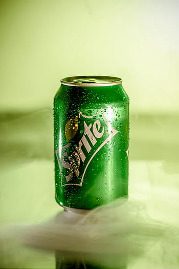 Sprite can, refreshing soda, lemon-lime soda, misty setting, refreshing qualities, mist effect, green can, cold drink, refreshing beverage, soda can, misty background