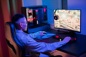 gaming, young man, computer, modern gaming setup, intense gaming, at home, gaming chair, computer monitor, keyboard, mouse, gaming setup