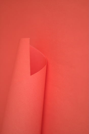 red card, red studio, minimalist design, red paper background, subtle curved fold, design projects, red backdrop, studio photography, minimalist photography, red studio setup, red paper texture