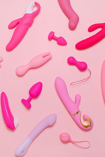 sex toys, pink vibrators, silicone accessories, adult toys, pastel background, variety of toys, pink adult products, vibrators collection, silicone sex toys, adult accessories, pastel pink toys